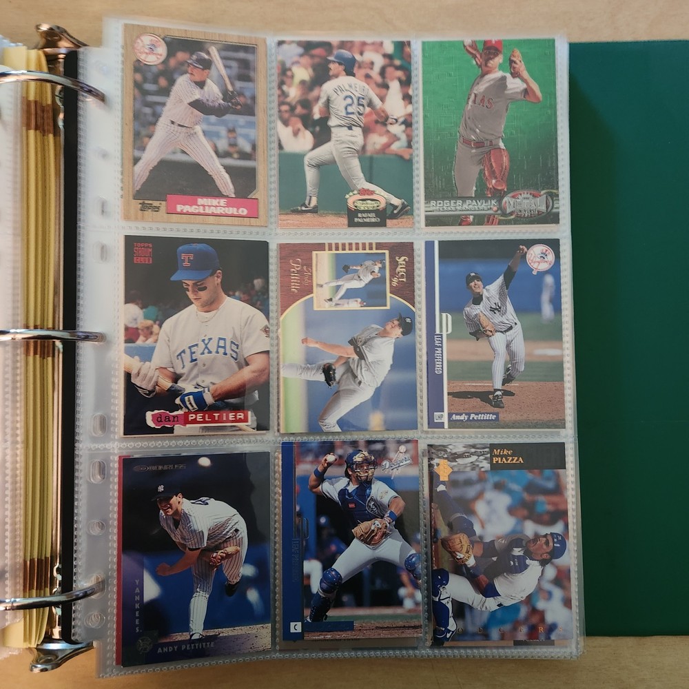 various baseball cards in great condition in binder sheets