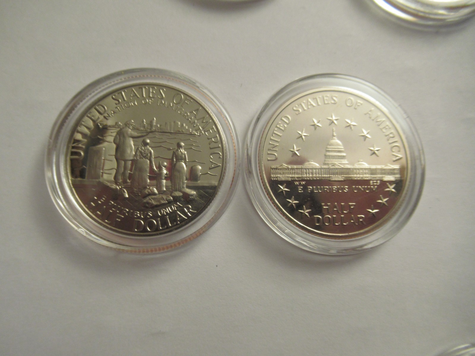 Lot of 11 US Clad half dollars, mix dates, w/ capsules