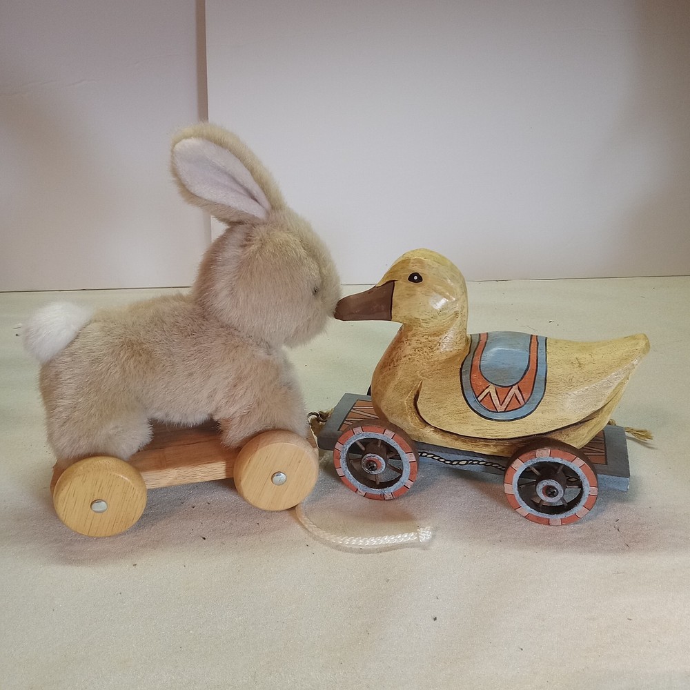 A bunny & duck on wheels pull toy