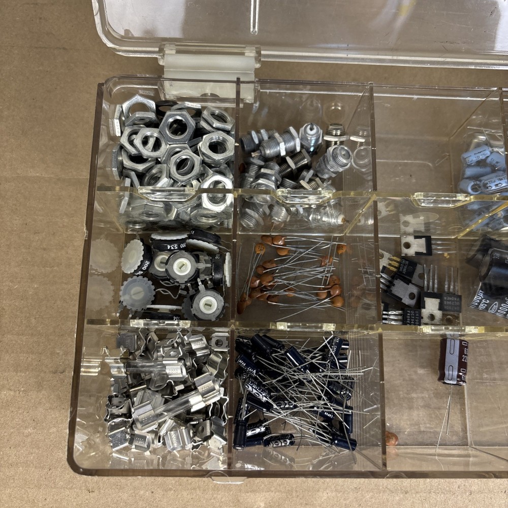 assorted electronics components, parts in a compartment box, NOS capacitors, etc