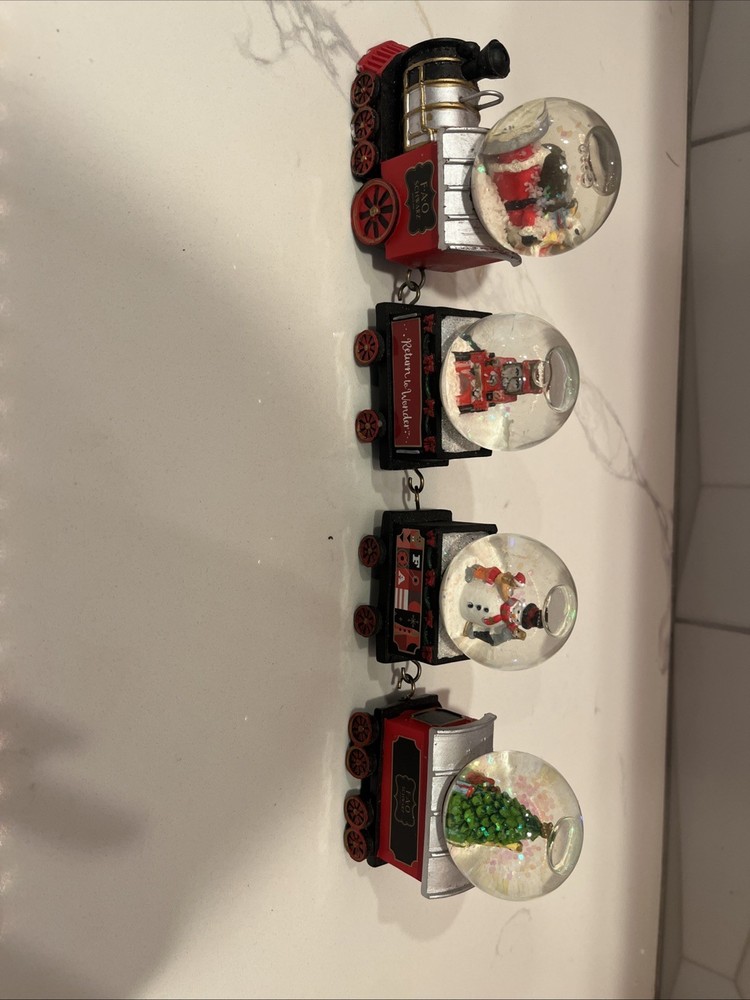 F.A.O SCHWARZ 4- piece Train Snow Globe Set