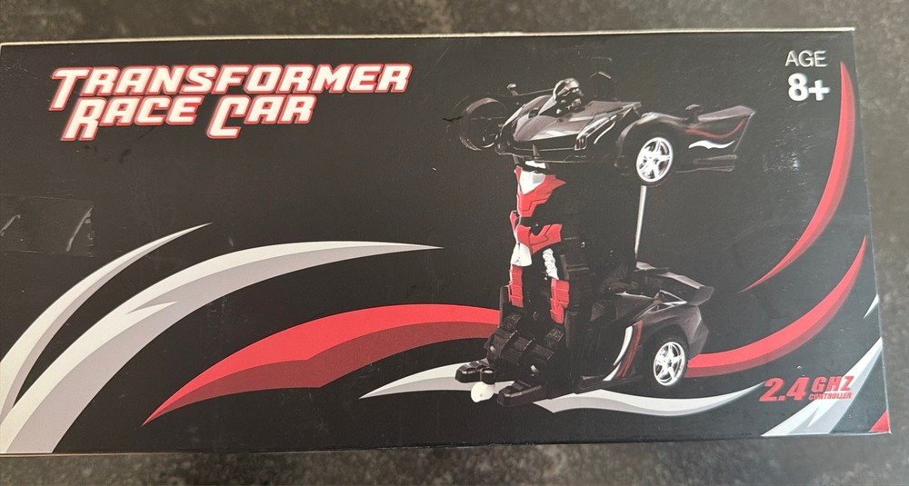 New Remote Control Transformer Race Car. Black and  Red. 2.4GHz controller.