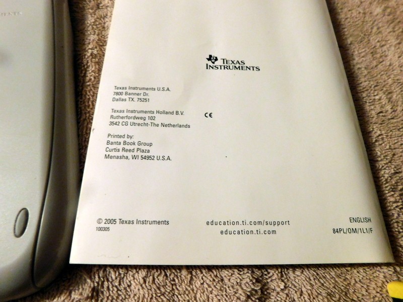 Texas Instruments TI-84 Plus Silver Edition Graphing Calculator & Manual Cords