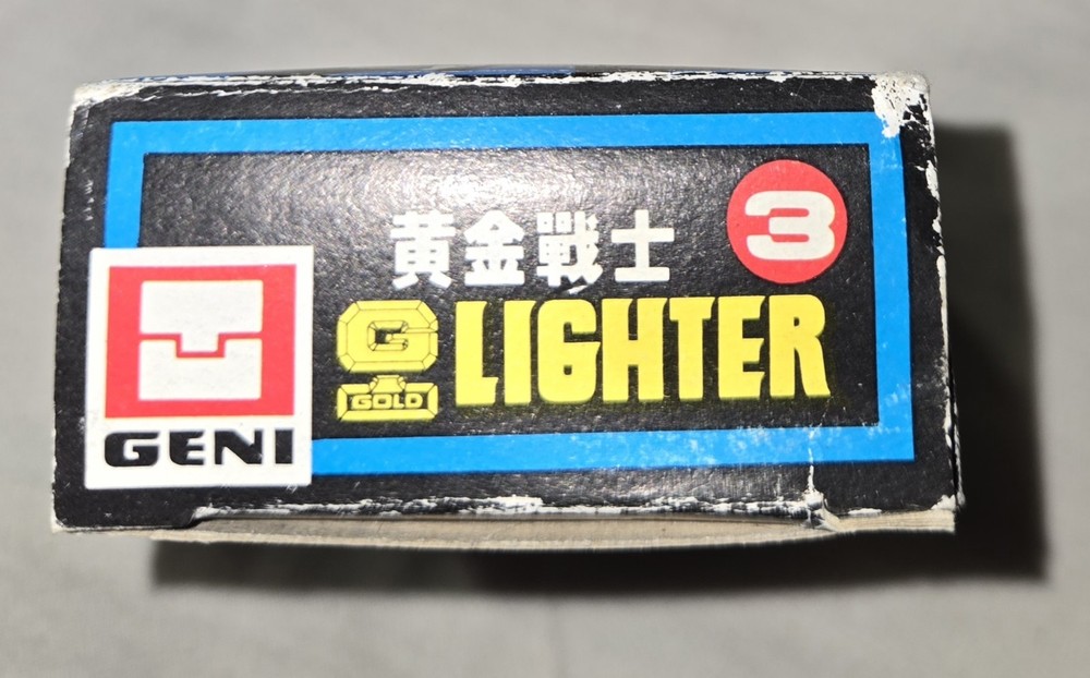 Geni Gold Lighter Robot