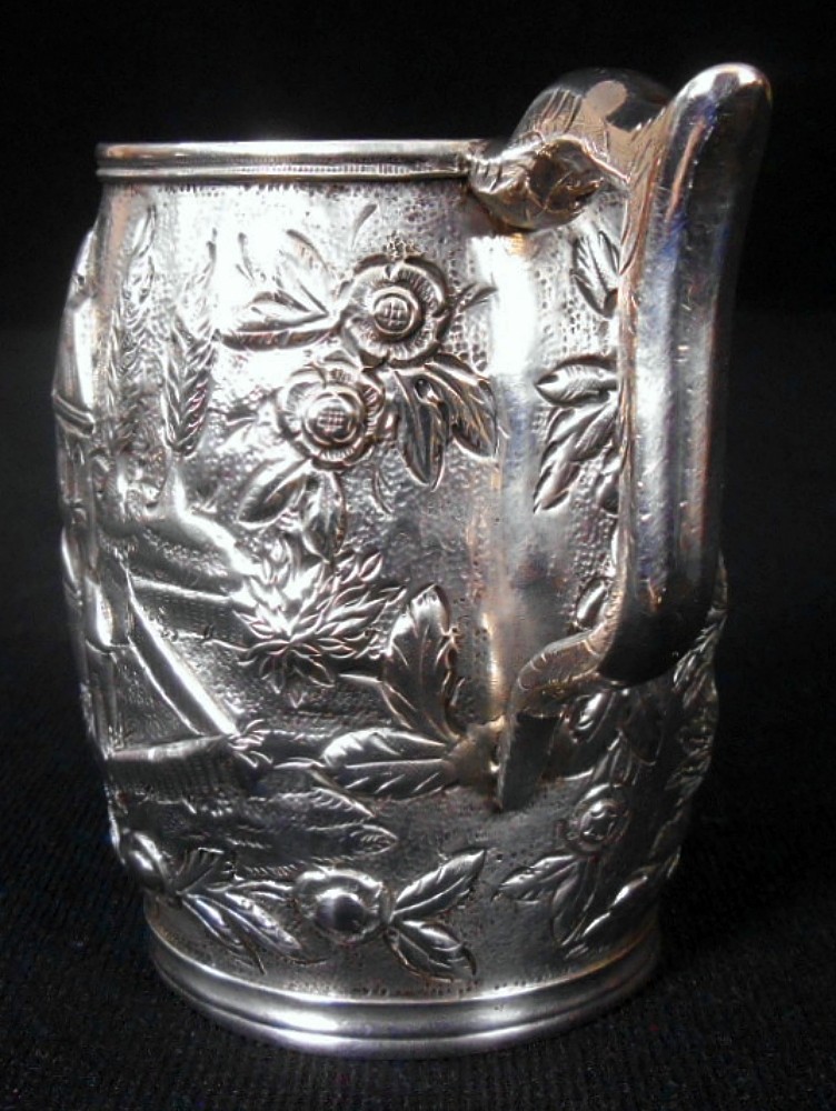 A solid silver child's mug, architectural repousse, S. Kirk & Son, 11 oz, c.1860