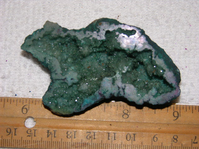 Geode cut & polished half with colored crystal center 3 inch E37