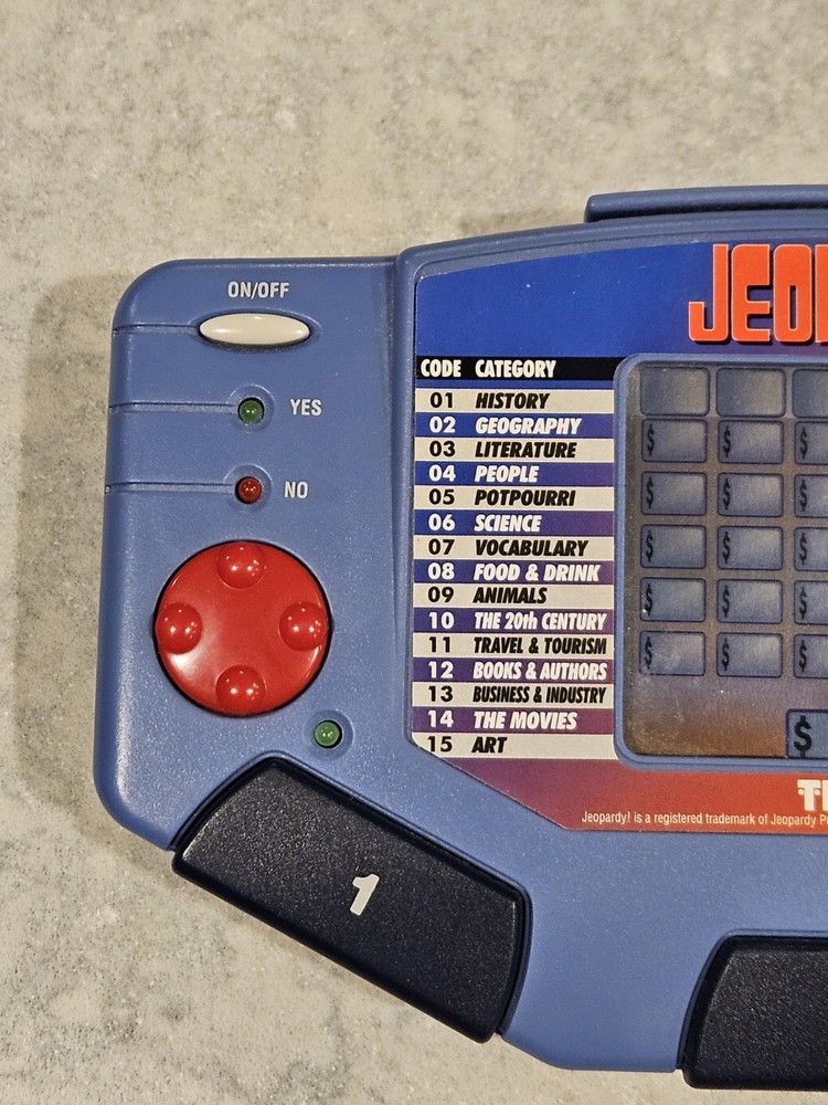 Tiger Electronics Jeopardy Hand Held Game 1995 with Answer Question Book