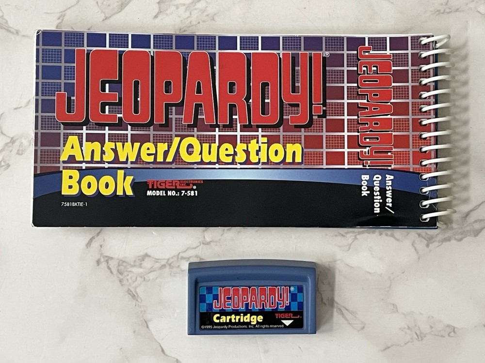Tiger Electronics Jeopardy Handheld Game w/ 2 Answer & Question Book & Cartridge