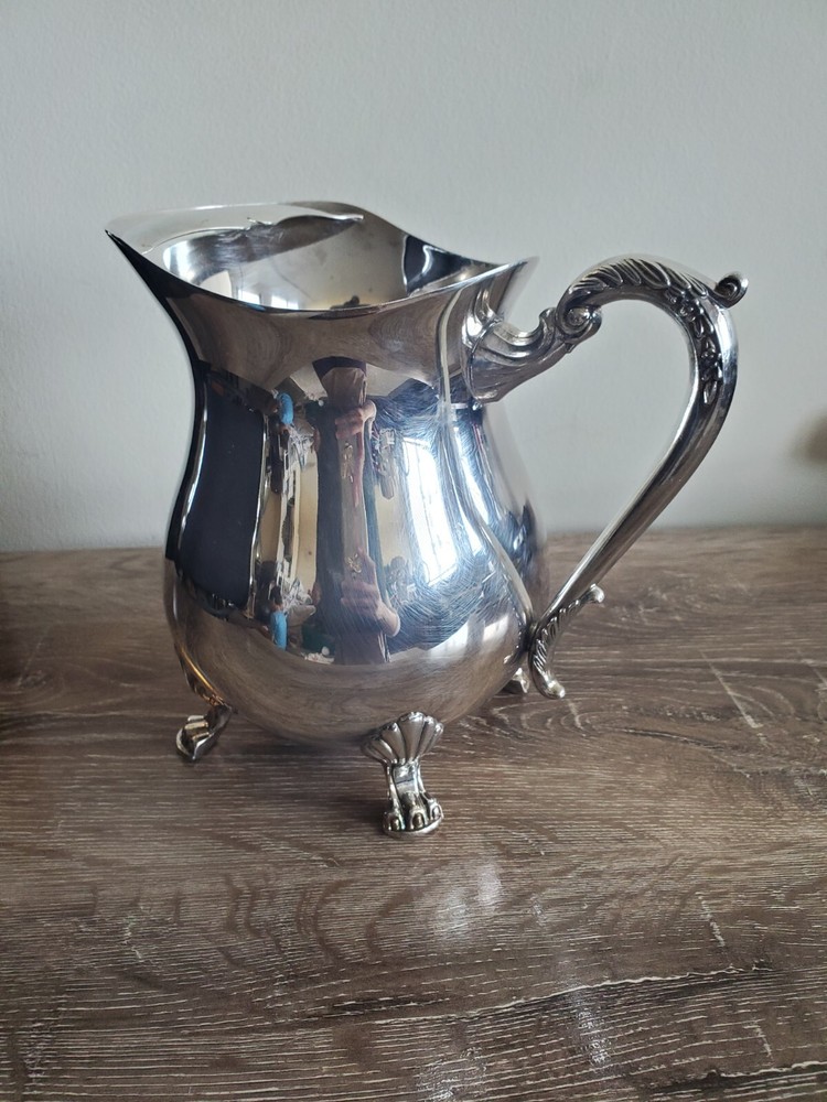 Cheeks Design &Art co. Silver plated footed pitcher