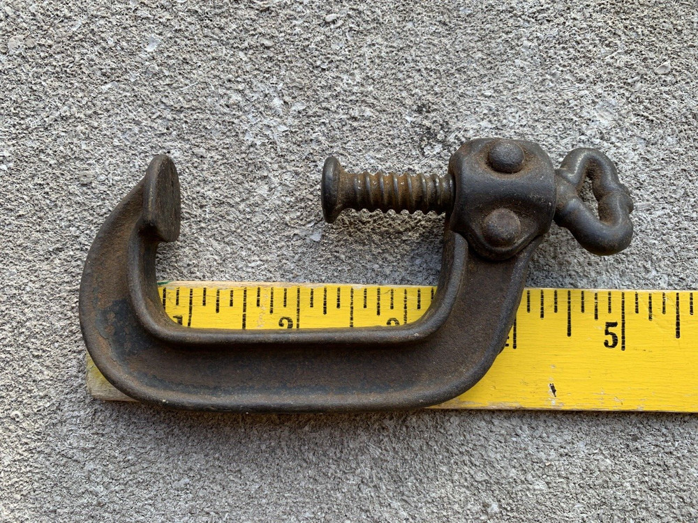 Small iron clamp held together with pins