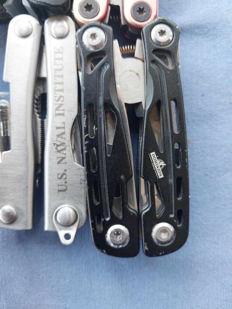 4 small multitudes with pliers knife scissors screwdriver's