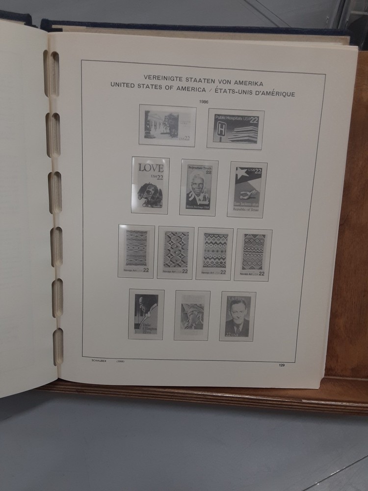1986-1989 US Hingeless Schaubek pages in Lighthouse spring back cover no stamps