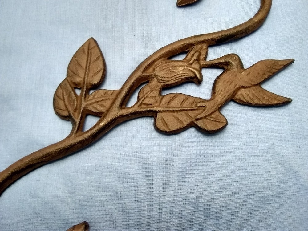 Hummingbird plant hook cast iron.