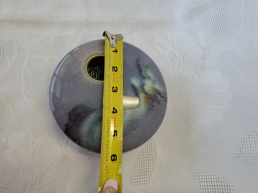 Ceramic single flower bud display vase.