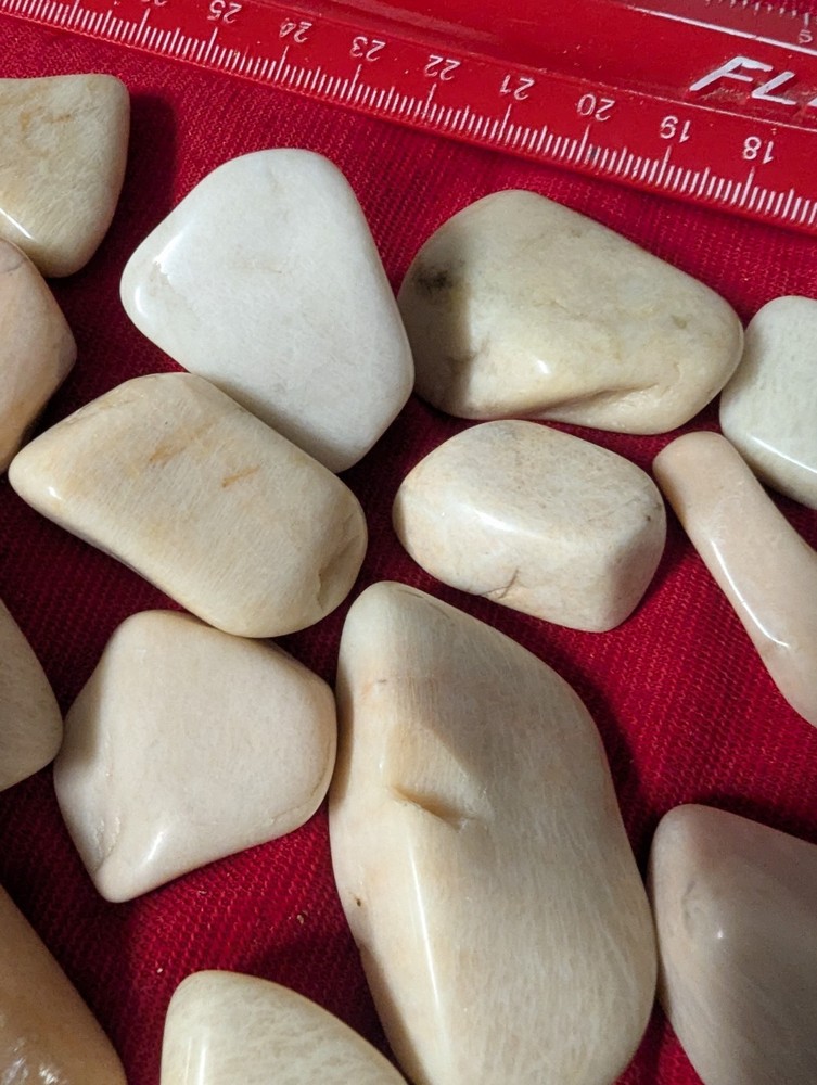 2 Off white large tumbled gemstones per lot.