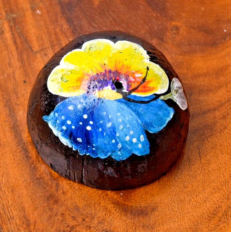 Coconut shells hand painted with different faces specified for hotel decorations