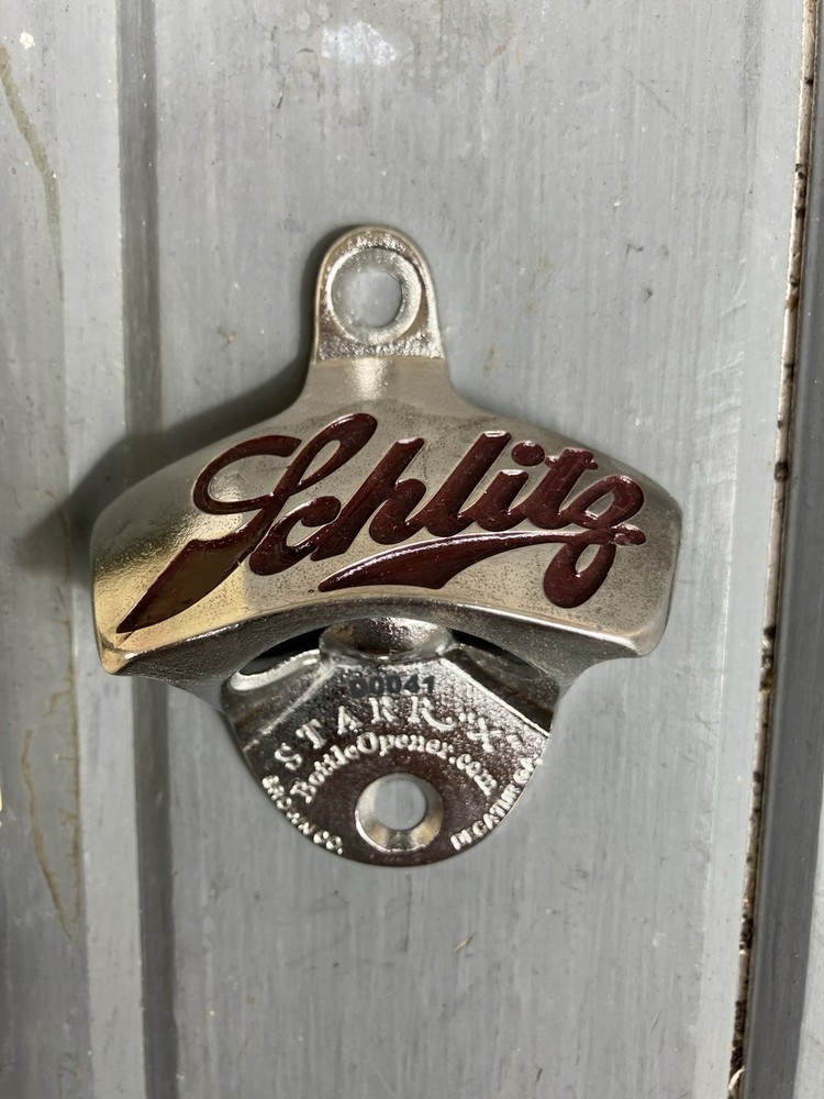 SCHLITZ STARR X WALL MOUNT BOTTLE OPENER.