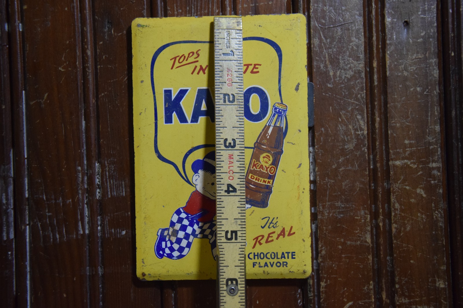 KAYO CHOCOLATE DRINK PAINTED METAL SIGN BOTTLE BOWLER MOON MULLINS CIRCA 1950s