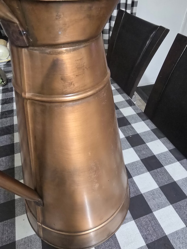 A masterpiece. An antique copper vase.