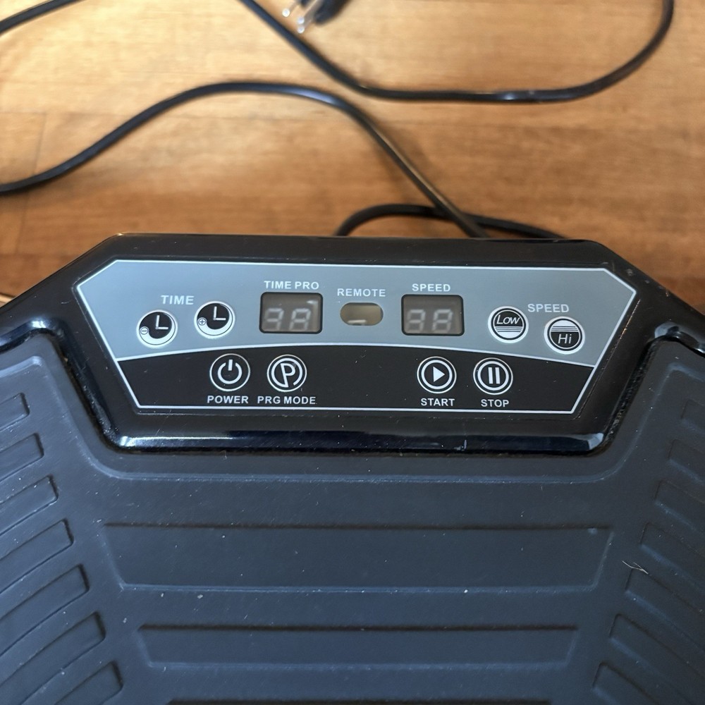 Black Vibration Plate Exercise Machine. Full-Body Vibrating Platform with Resist