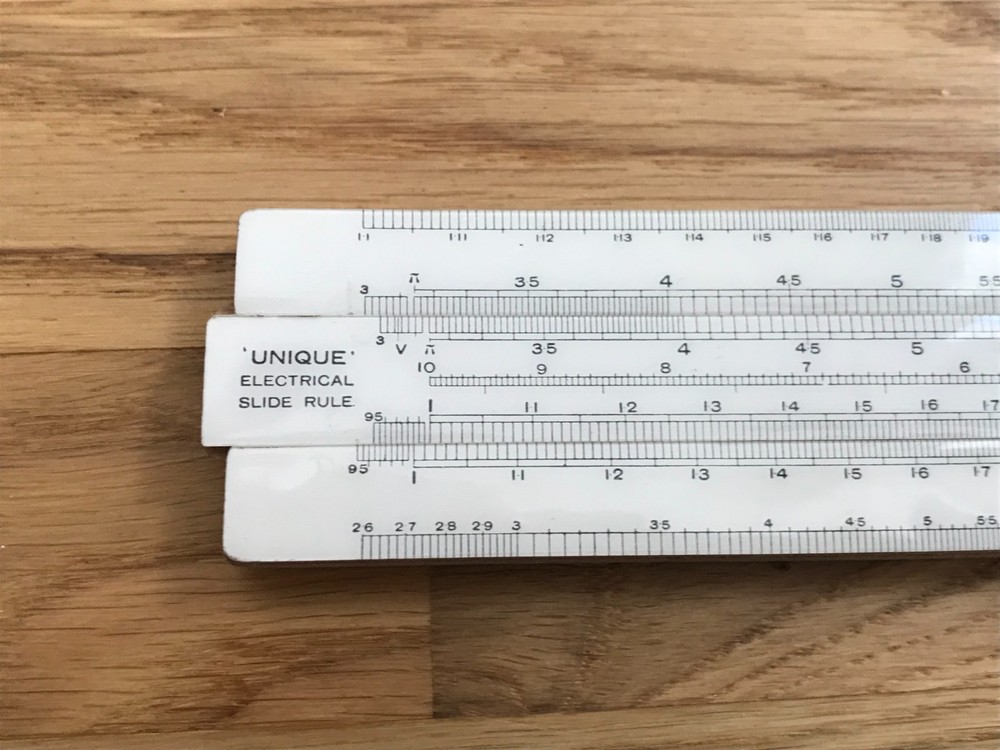 nice old good looking unique electrical slide rule in case