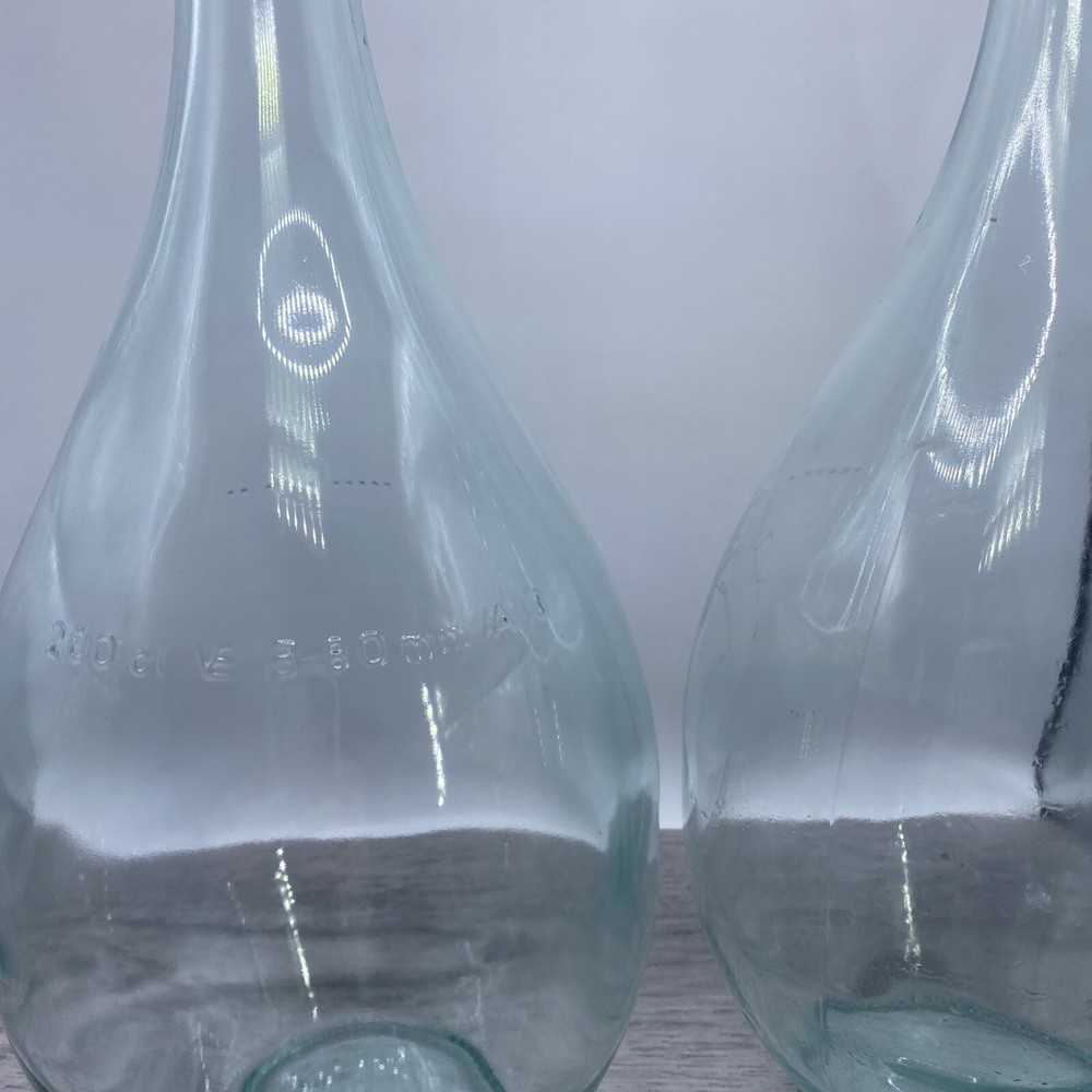 Two old wine bottles - 1 Cork inside - Label Residue