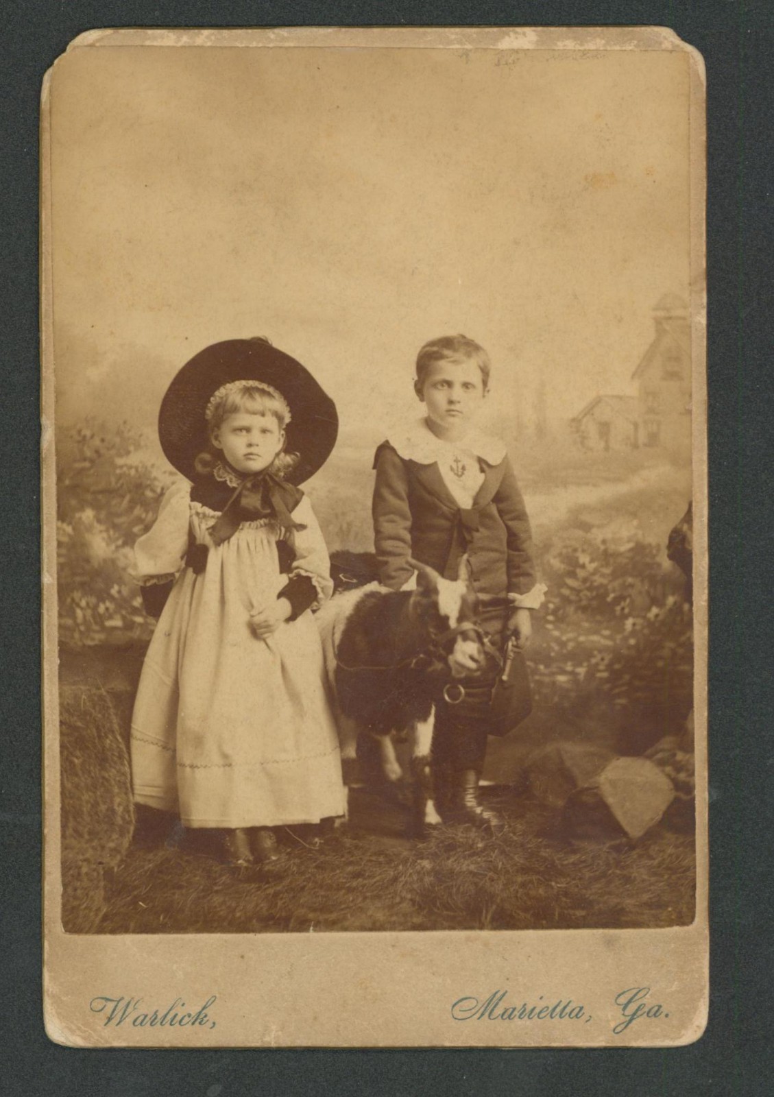 Studio pose of Father and two Daugthers, .M.V. LOMAX ~ ABBEVILLE ,S.C.