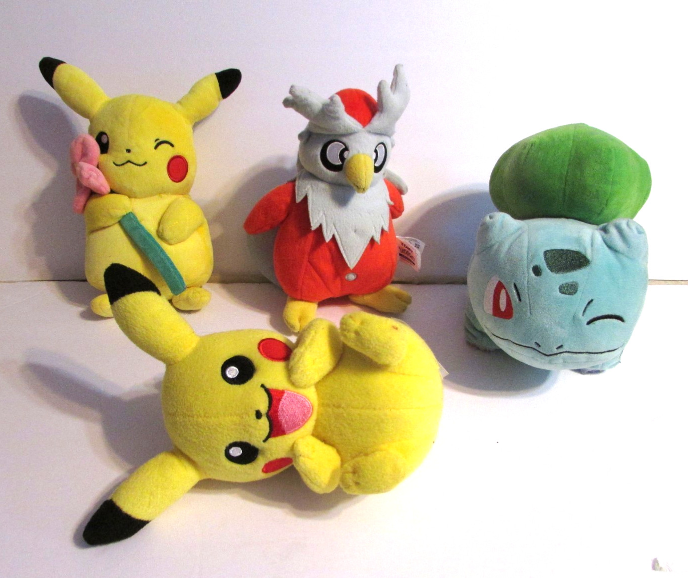 Lot Of 4 Pokemon Plush Pikachu W/Flower Delibird Bulbasaur