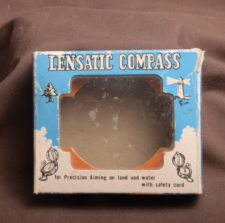 two lensatic compasses one with box