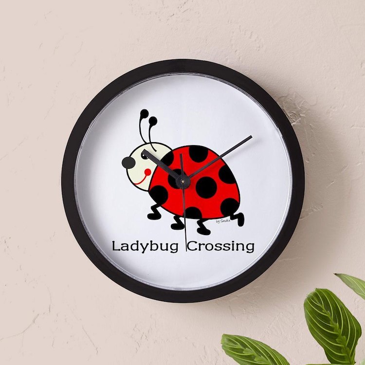 CafePress Ladybug Crossing 10" Wall Clock (135676360)
