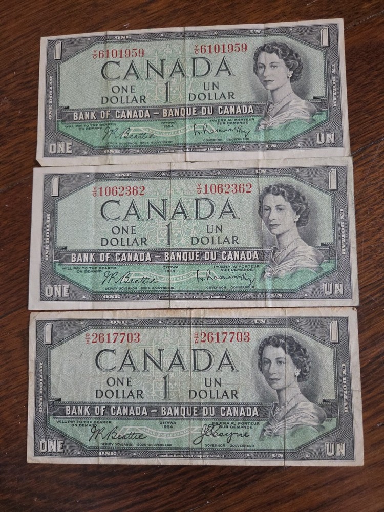 Three 1954 Canadian One Dollar Bills