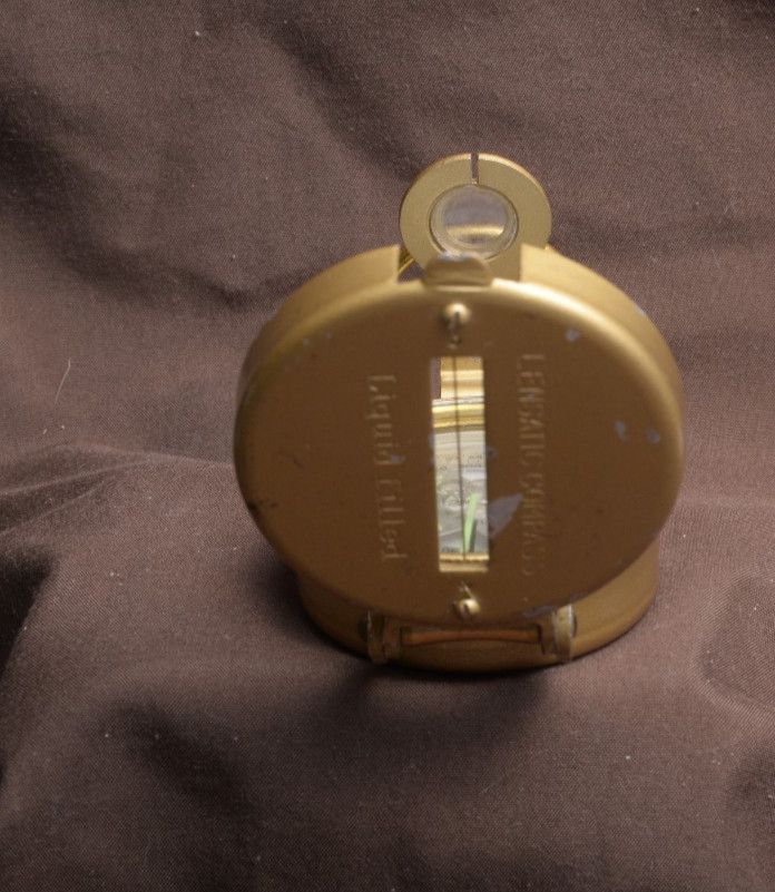 two lensatic compasses one with box