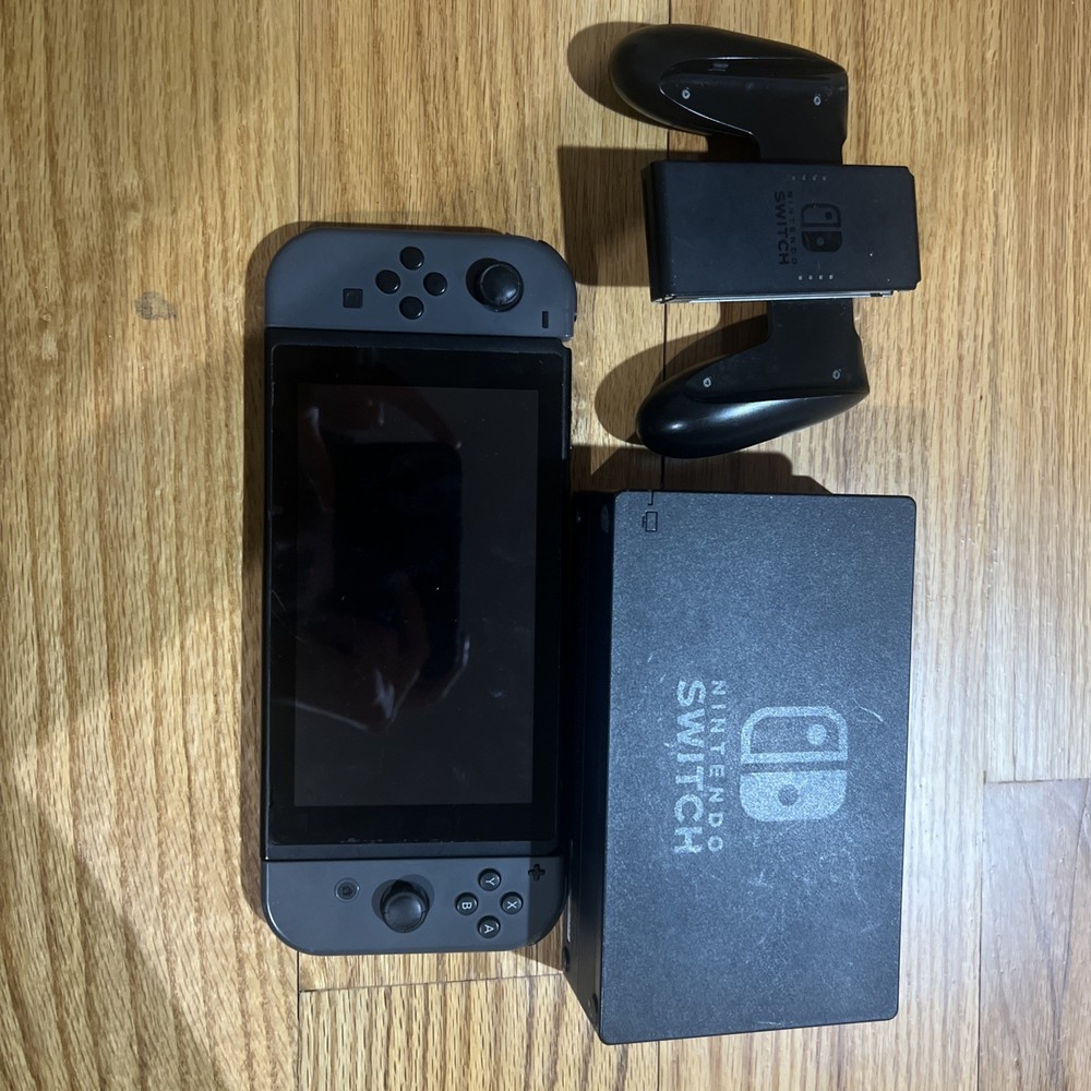 Nintendo Switch Console W/ Dock, Joycon Grip, & Joycons “READ”