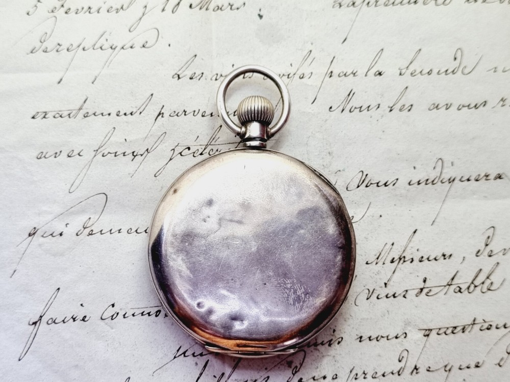 silver open face pocket watch