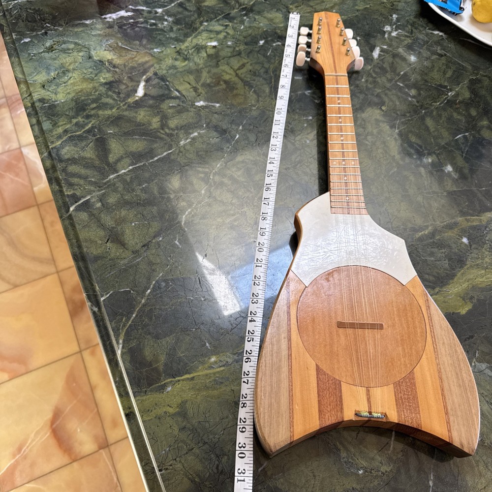 8-string Tahitian Ukulele. Model Featuring A Turtle-shaped Body. Used
