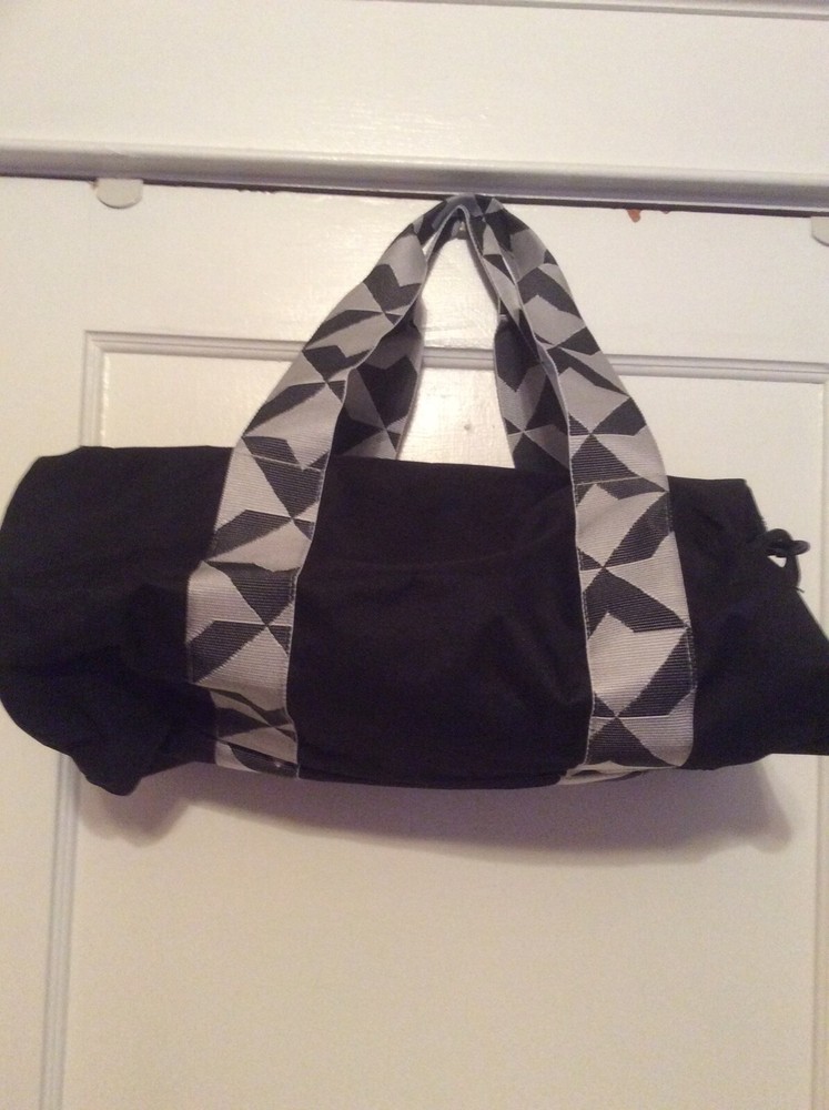 Twelve NYC black Duffel bag. Adjustable shoulder strap.