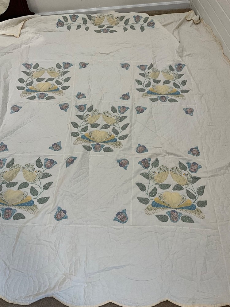 Vintage handmade quilt with birds
