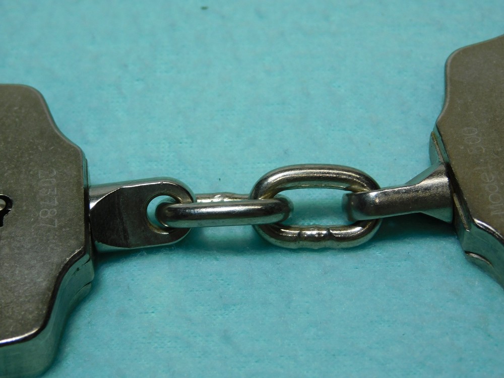 Peerless Handcuff Co. Model 500 Nickle Plated Handcuffs With Key.