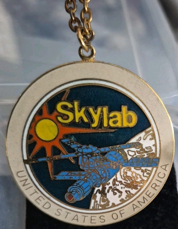 Vintage Skylab medallion on a chain.