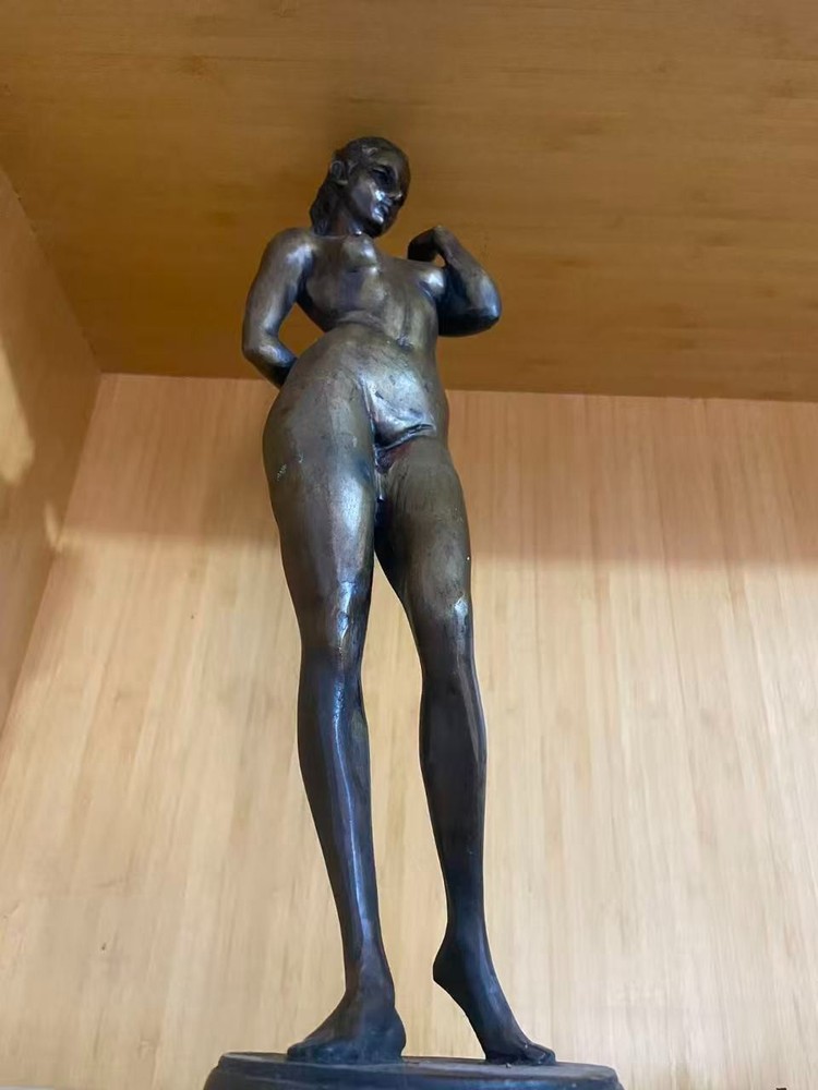 old bronze Bathing girl statue from a old man