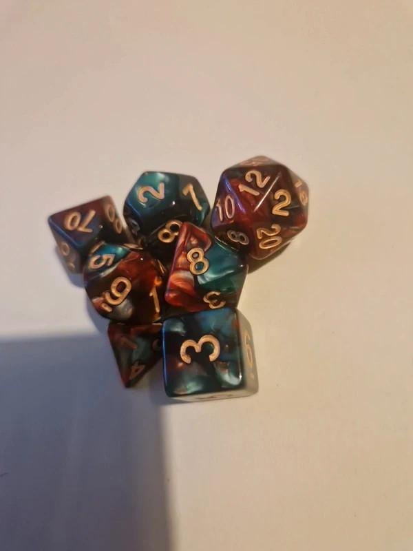Green and red marble effect polyhedral dice set