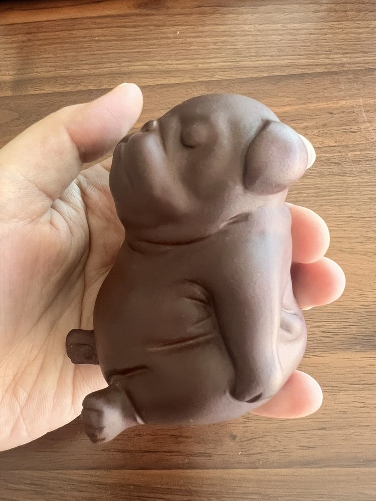 Purple clay ceramic puppy.
