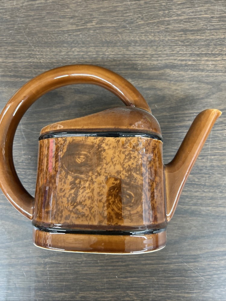 Multi shade brown ceramic circular handle decorative planter 9"h., 11 1/2"w