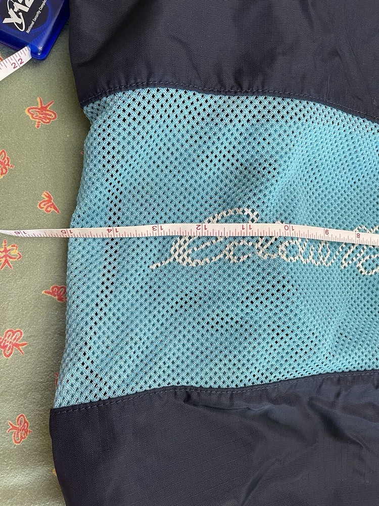 Eddie Bauer navy and teal drawstring bag with backpack straps
