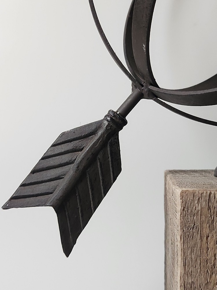 Metal Orb And Arrow Decor On Standing Base
