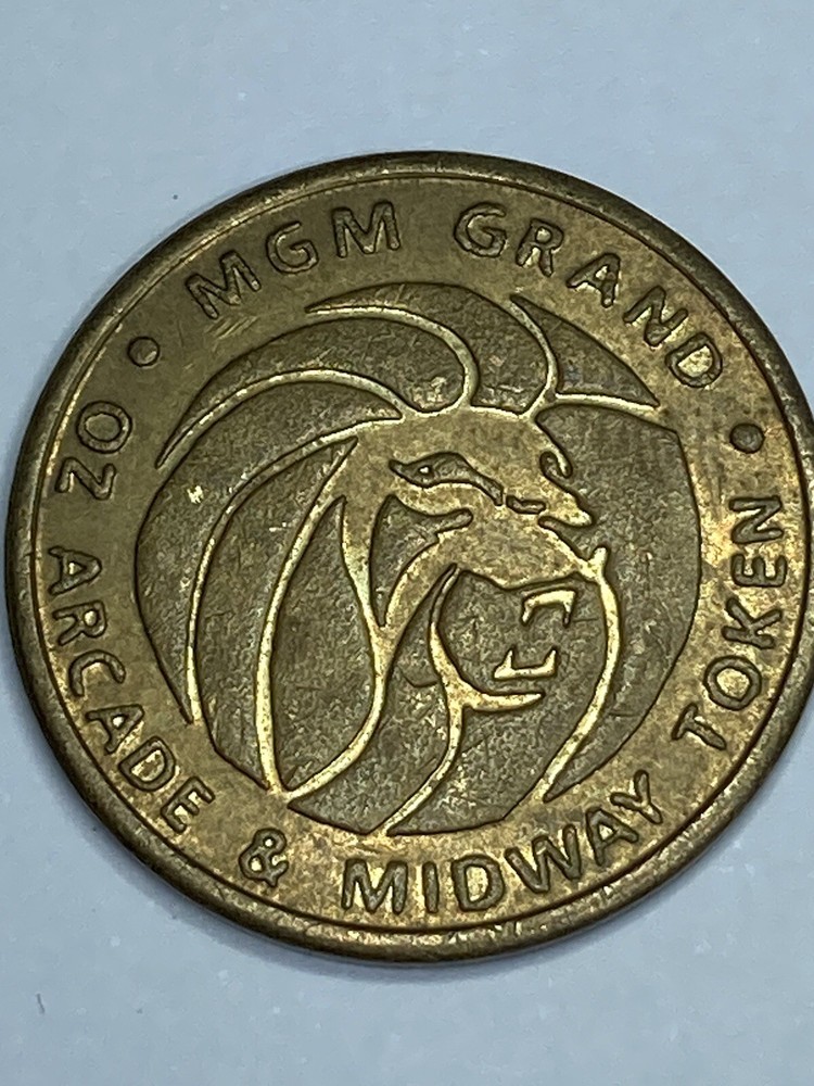 MGM GRAND ARCADE AND MIDWAY TOKEN!   e2066UXX  (#d4)