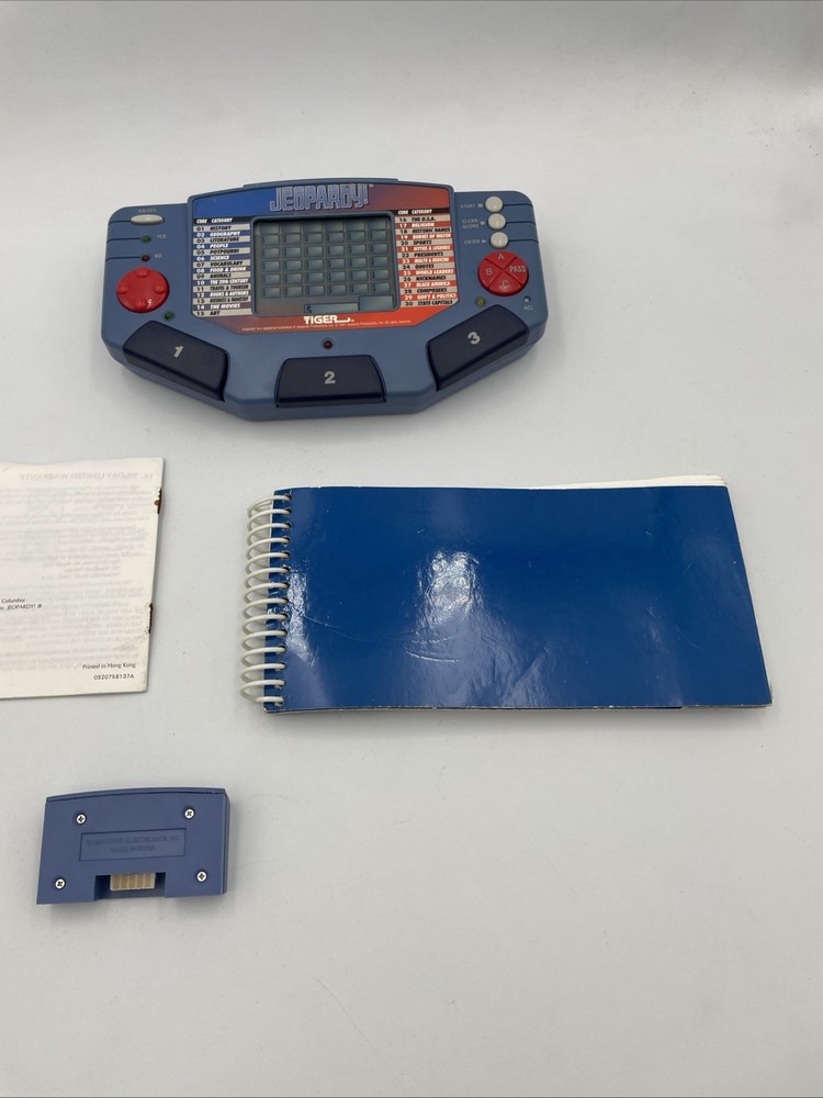 Tiger Electronics Jeopardy Hand Held Game 1995 with Answer Book & Manual E1