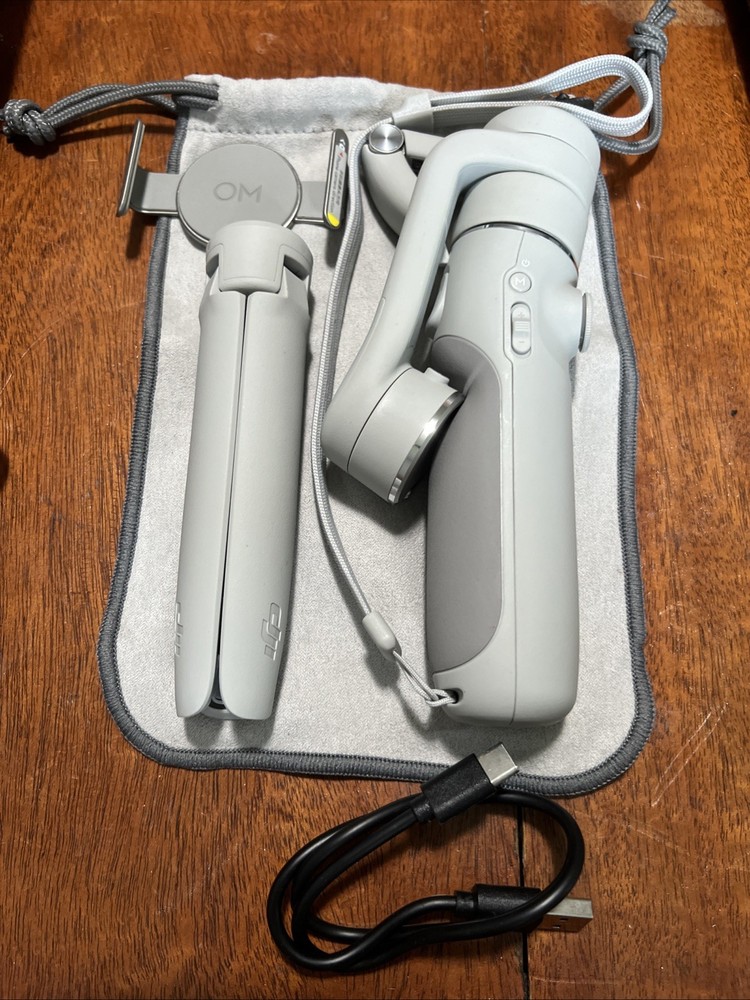 DJI OM 5 3-Axis Smartphone Gimbal Stabilizer. Includes Hard Case And Pouch