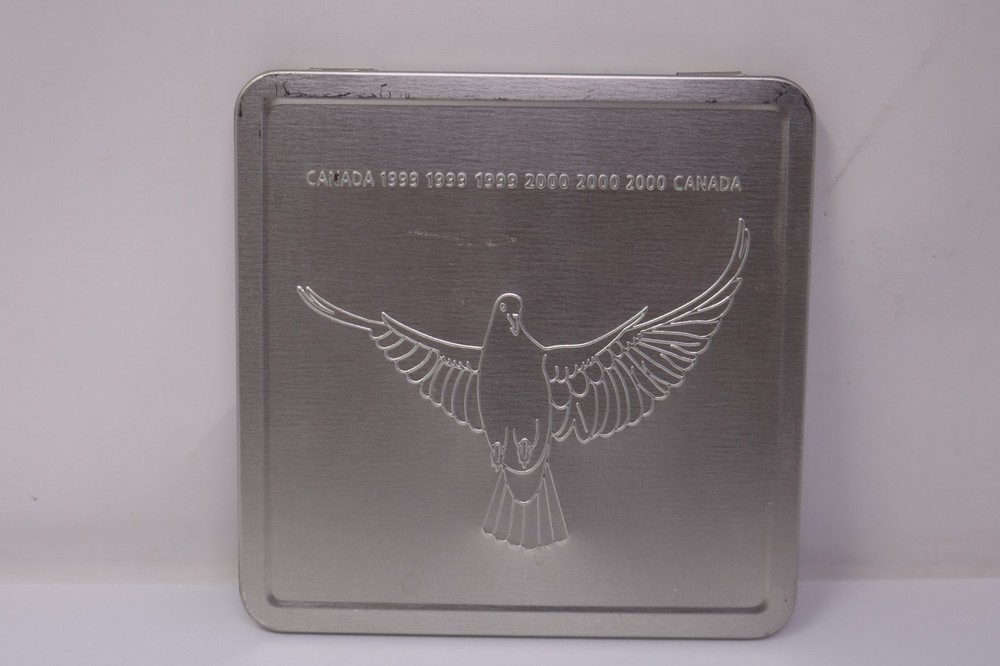 Canada Post - 1999 2000 Official Millennium Keepsake Stamps & Coin collection