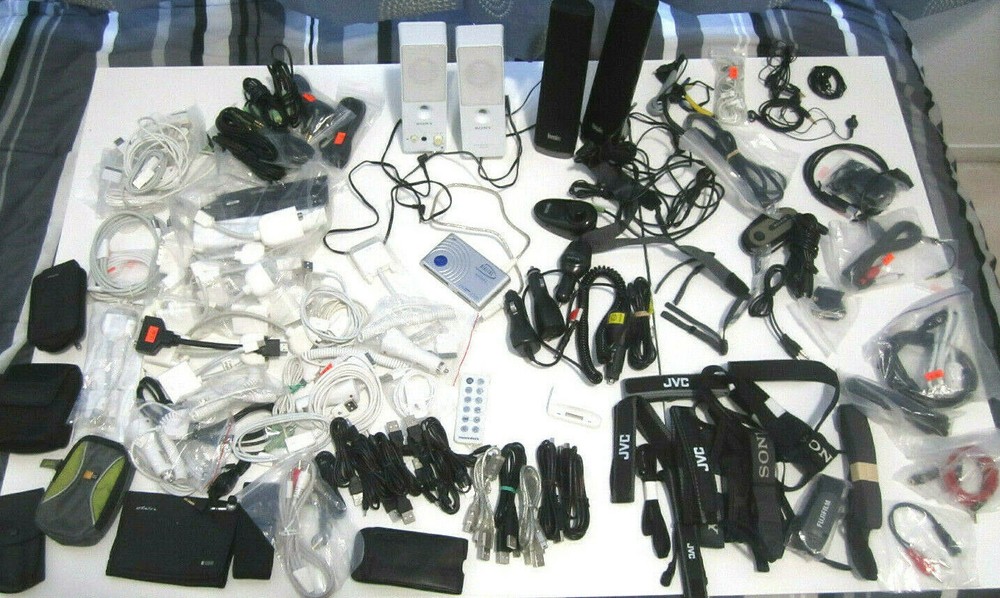 Lot of electronics, Assorted camera straps , Assorted cables and more      ZZ